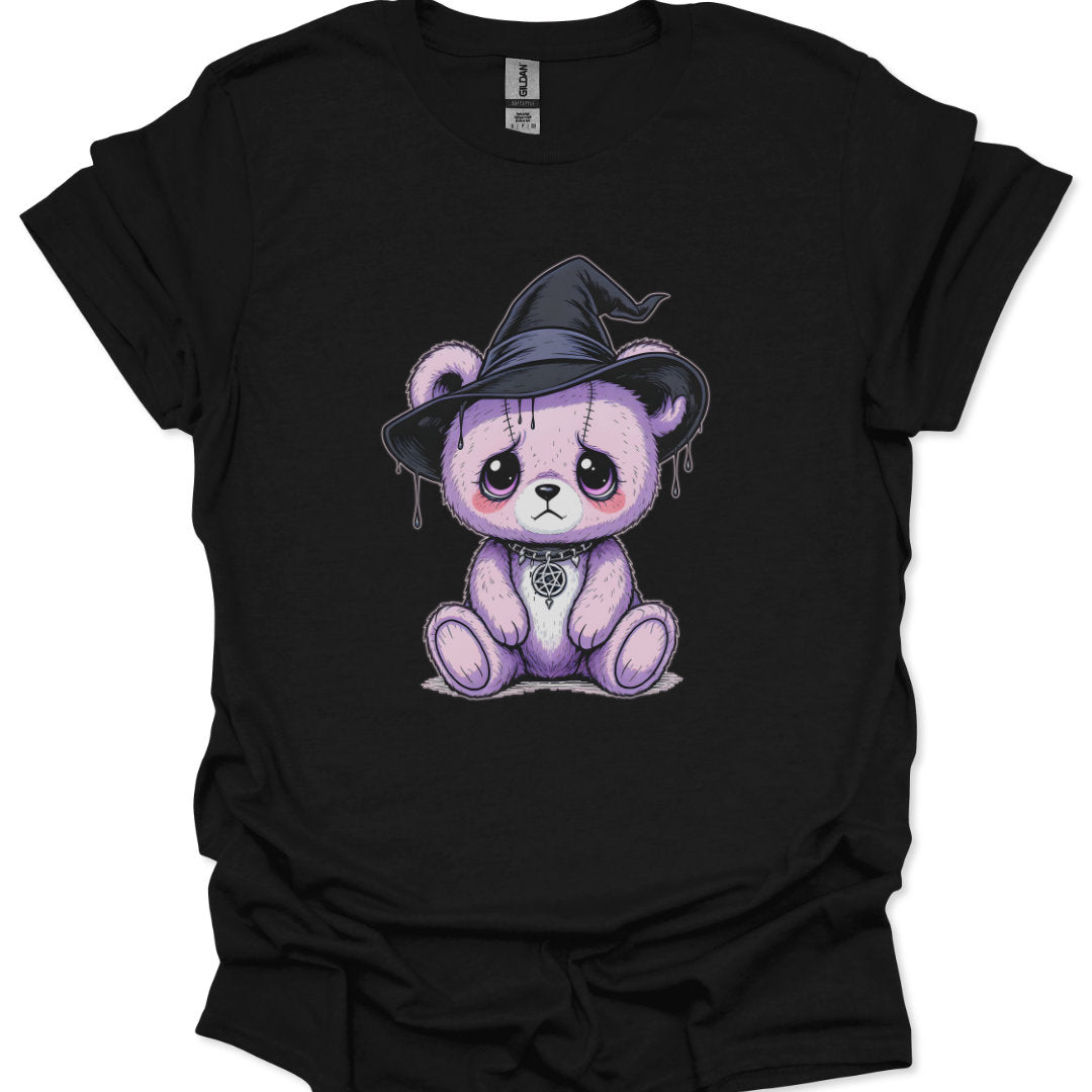 Black t-shirt with a purple teddy bear wearing a witch hat on a white background