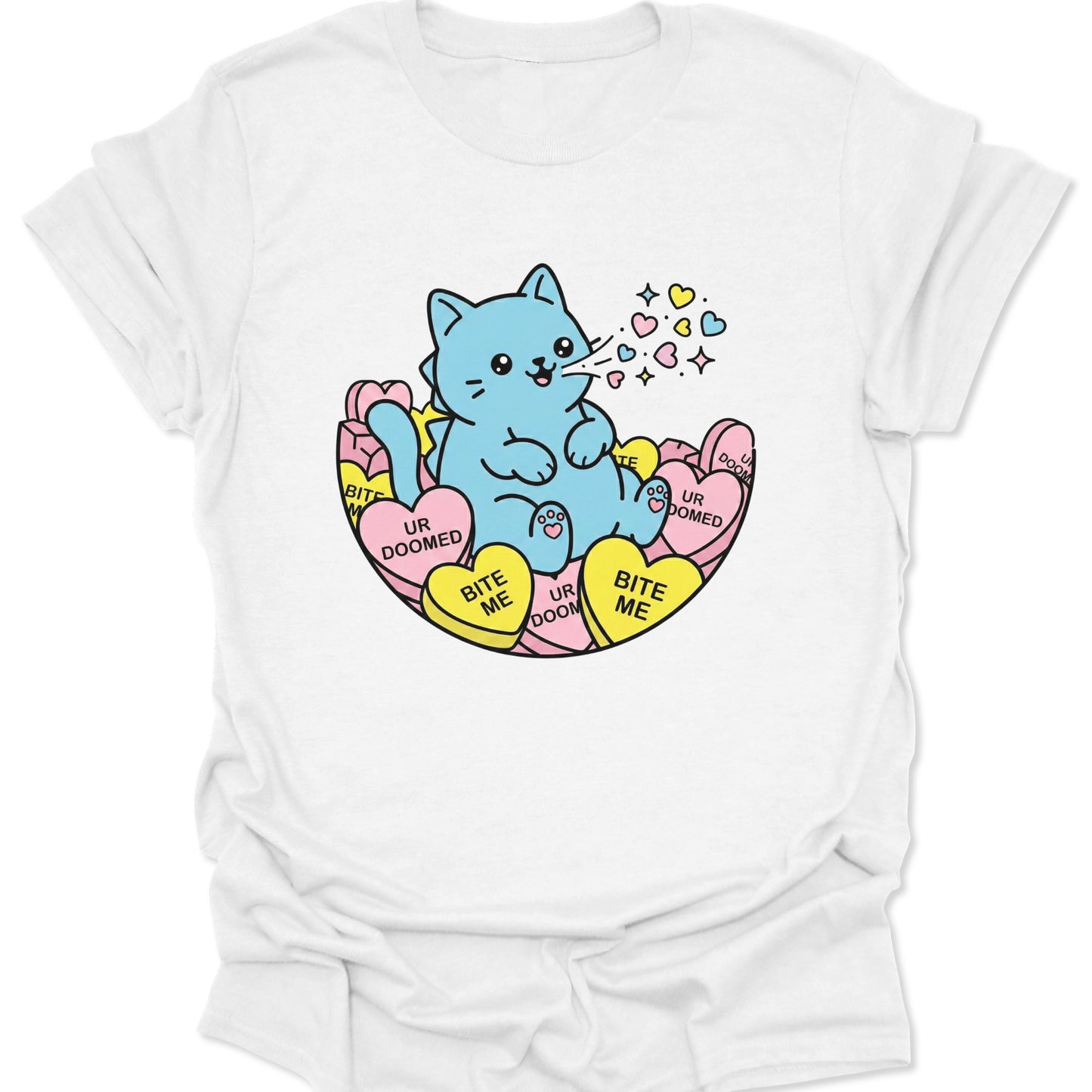 White unisex adult t-shirt featuring a blue chibi cat with bite me candy hearts in a kawaii pastel goth style.