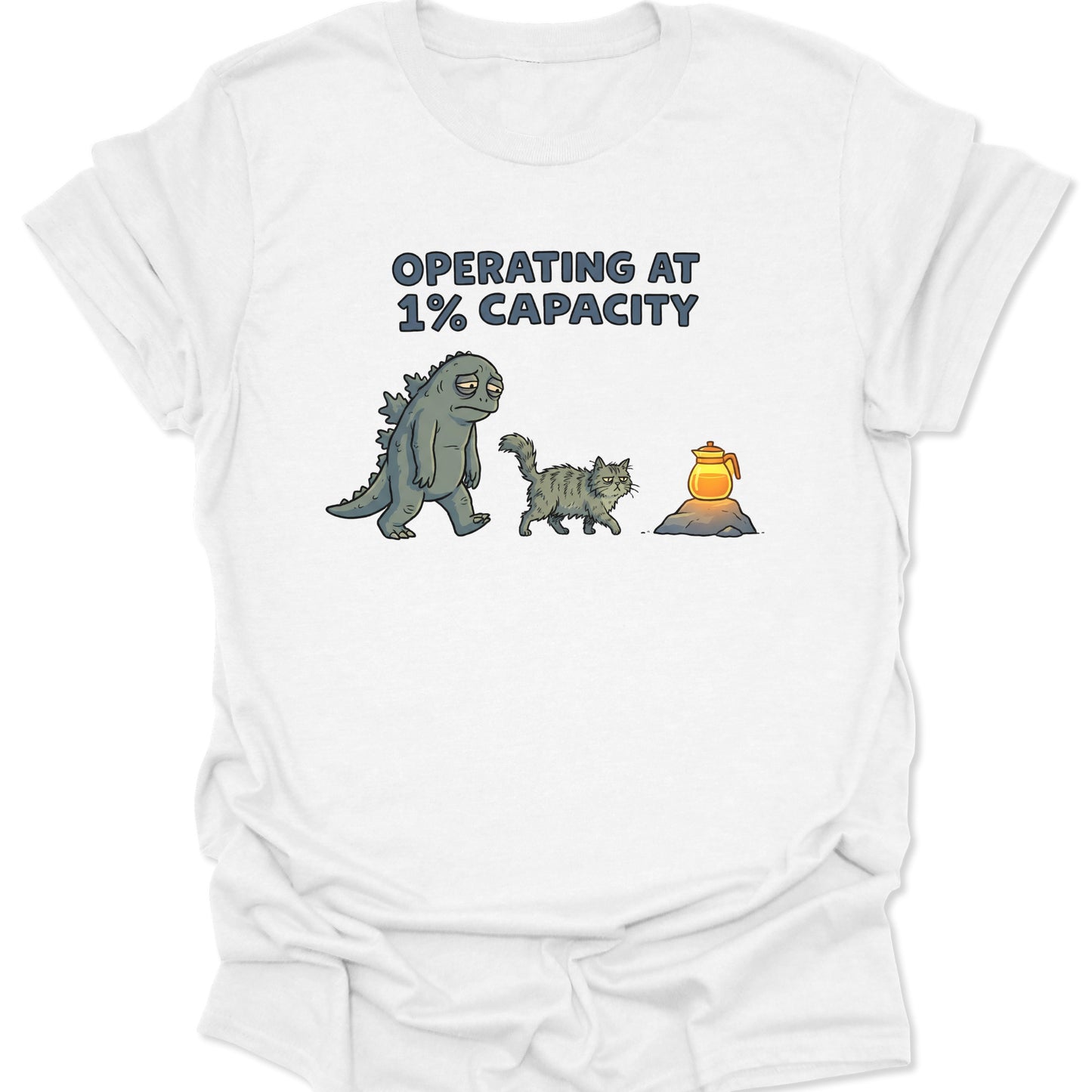 White cotton tee with funny exhausted kaiju and grumpy cat seeking caffeine graphic for burnout mood and anime fans.
