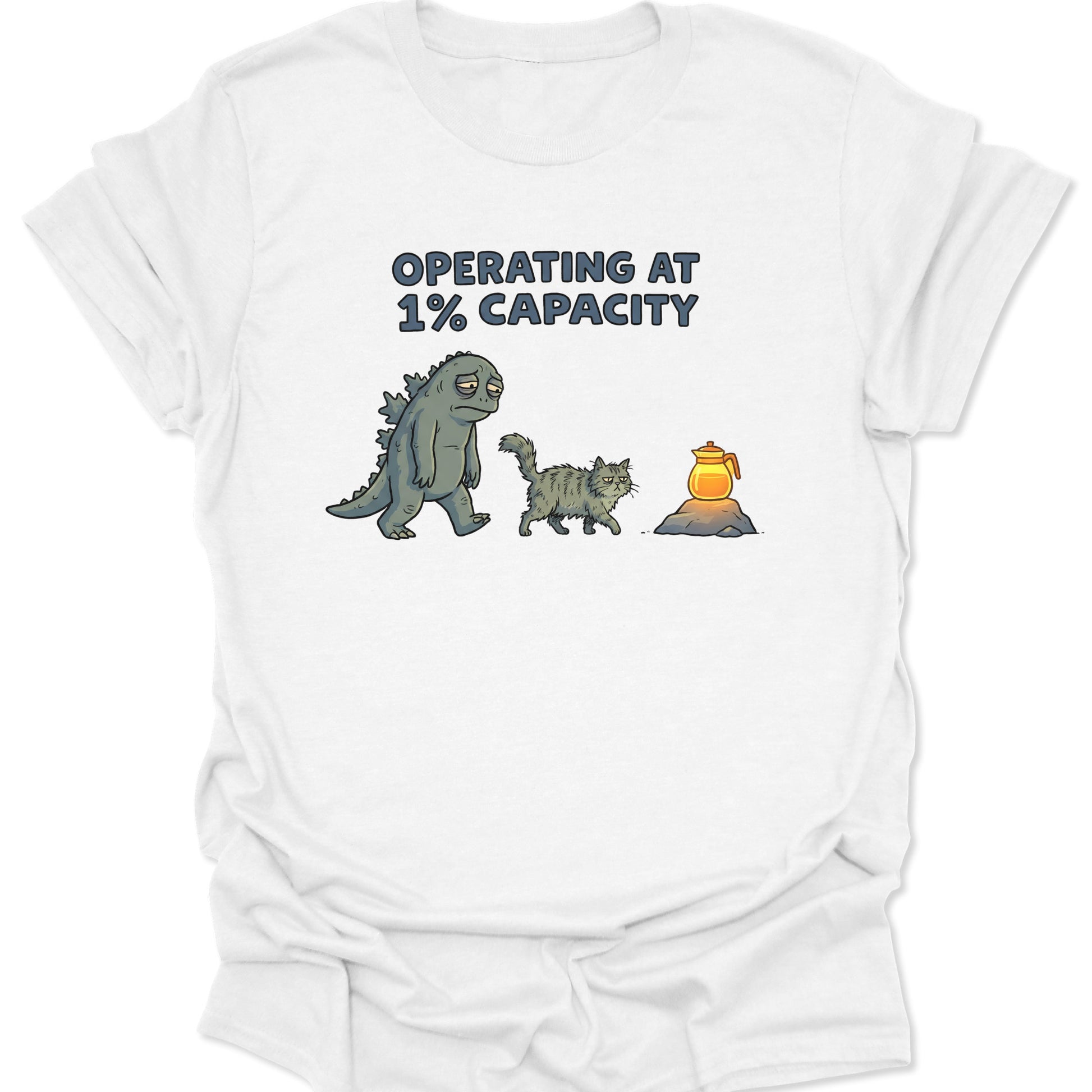 White cotton tee with funny exhausted kaiju and grumpy cat seeking caffeine graphic for burnout mood and anime fans.
