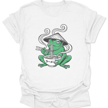 White unisex adult t-shirt featuring a kawaii frog eating Japanese ramen noodles with retro steam swirls and katakana text.