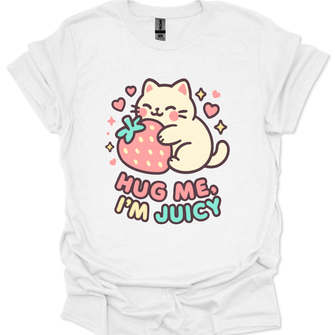 White t-shirt with a cartoon cat holding a strawberry and text 'Hug Me, I'm Juicy' on a white background