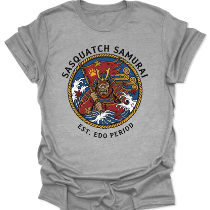 Sport Grey unisex adult t-shirt with an Irezumi-style samurai bigfoot graphic surrounded by a rope border and maple leaves.