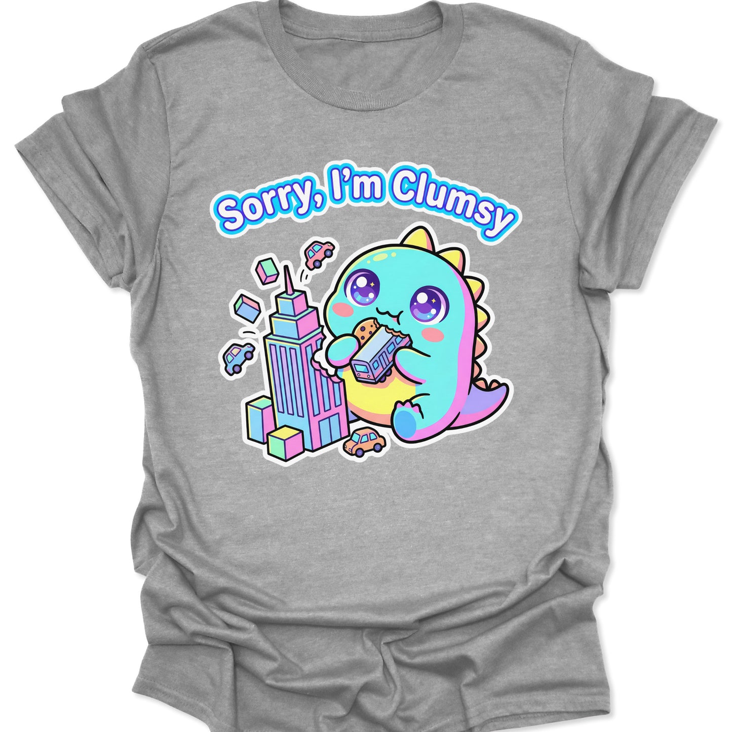 Sport Grey unisex t-shirt featuring a pastel chibi kaiju eating a bus with "Sorry, I'm Clumsy" text in bubbly letters.