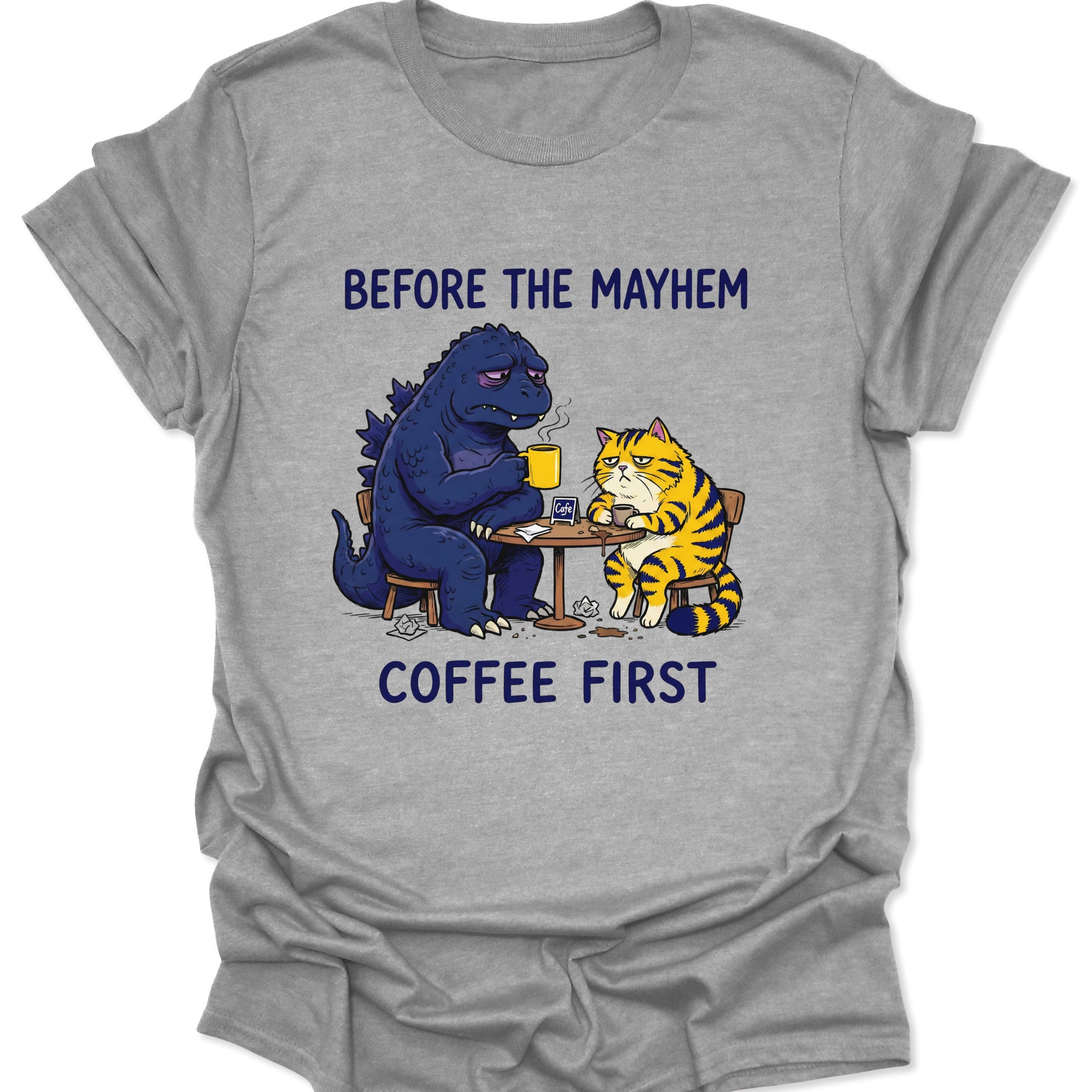 Sport Grey unisex adult t-shirt featuring a tired blue monster and yellow cat drinking coffee before causing mayhem.