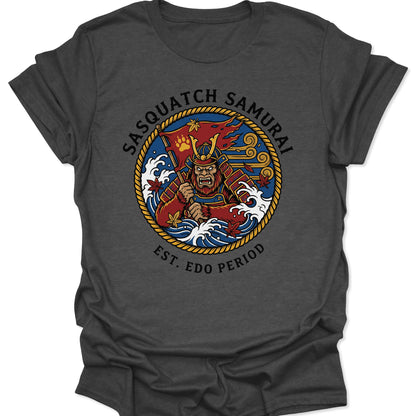 Dark Heather unisex adult t-shirt showcasing a mythical Sasquatch Samurai in traditional Japanese armor with ukiyo-e waves.