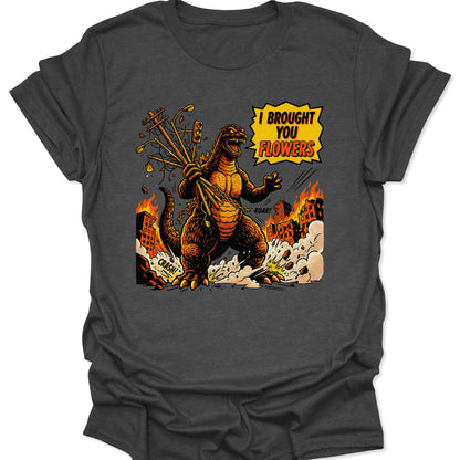 Dark Heather unisex adult t-shirt with a funny monster graphic saying I Brought You Flowers amidst city destruction.