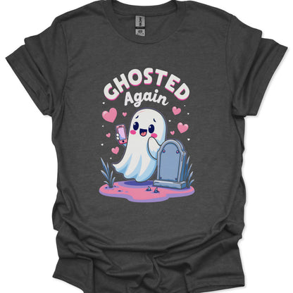 Dark gray t-shirt with a cartoon ghost holding a phone and tombstone, text 'Ghosted Again', on a white background.
