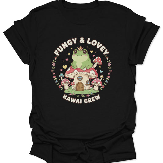 Black unisex adult t-shirt featuring high-contrast kawaii frog on a mushroom house with colorful cottagecore fungus art.