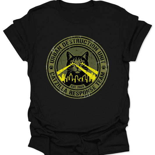 Black unisex adult t-shirt featuring a distressed kaiju catzilla seal with yellow laser eyes over a city skyline.
