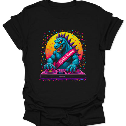Black 100% ring-spun cotton shirt featuring a vibrant neon Kaiju DJ monster in a pop-art style, isolated on a clean white background.