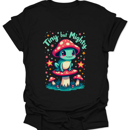 Black 100% ring-spun cotton shirt featuring a vibrant teal frog with a mushroom hat in a whimsical chibi art style, isolated on a solid black background.