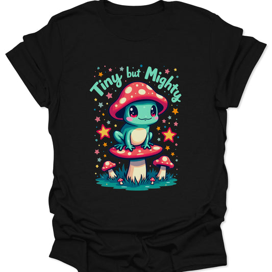 Black 100% ring-spun cotton shirt featuring a vibrant teal frog with a mushroom hat in a whimsical chibi art style, isolated on a solid black background.