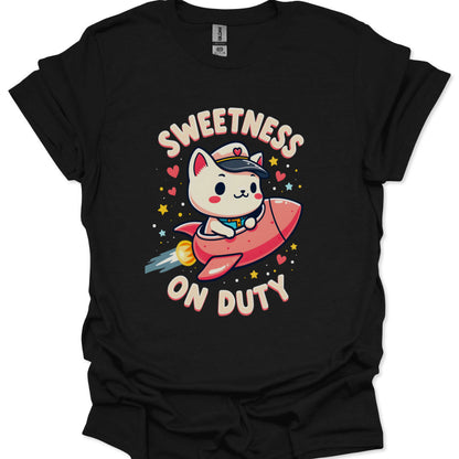 Black t-shirt with a cartoon cat in a rocket ship and 'Sweetness on Duty' text.