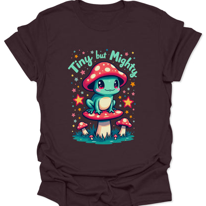 Dark Chocolate brown cotton shirt featuring a teal frog perched on a red-capped mushroom in a forest-core illustration style, isolated on a deep brown background.
