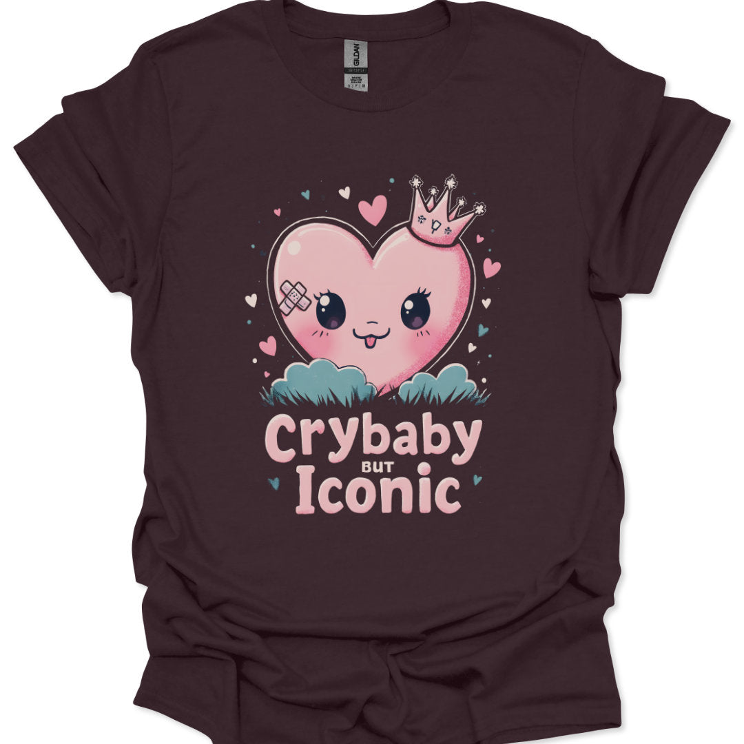 Brown t-shirt with a heart graphic and text 'Crybaby but Iconic' on a white background