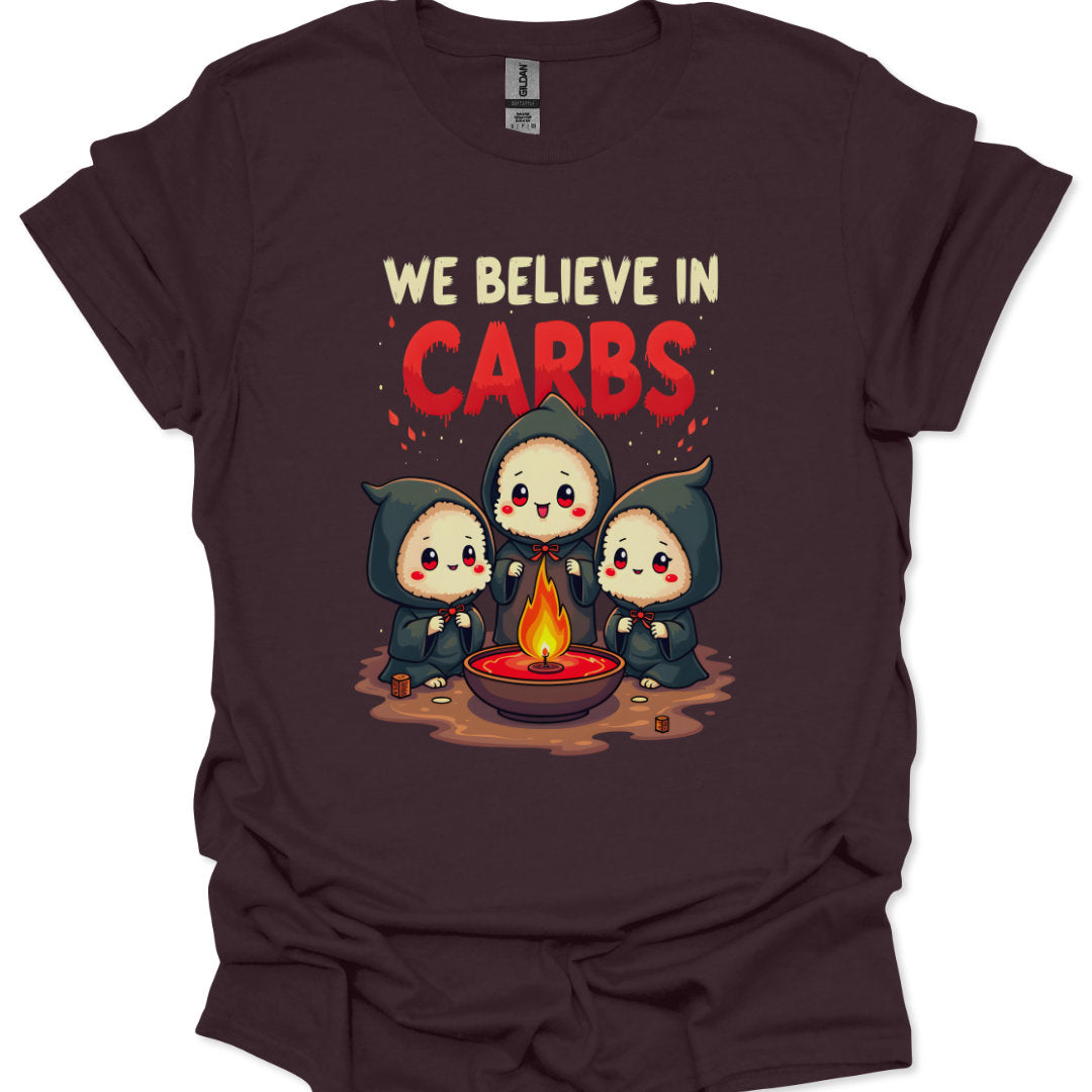 Brown t-shirt with cartoon characters around a fire and 'We Believe in Carbs' text on a white background