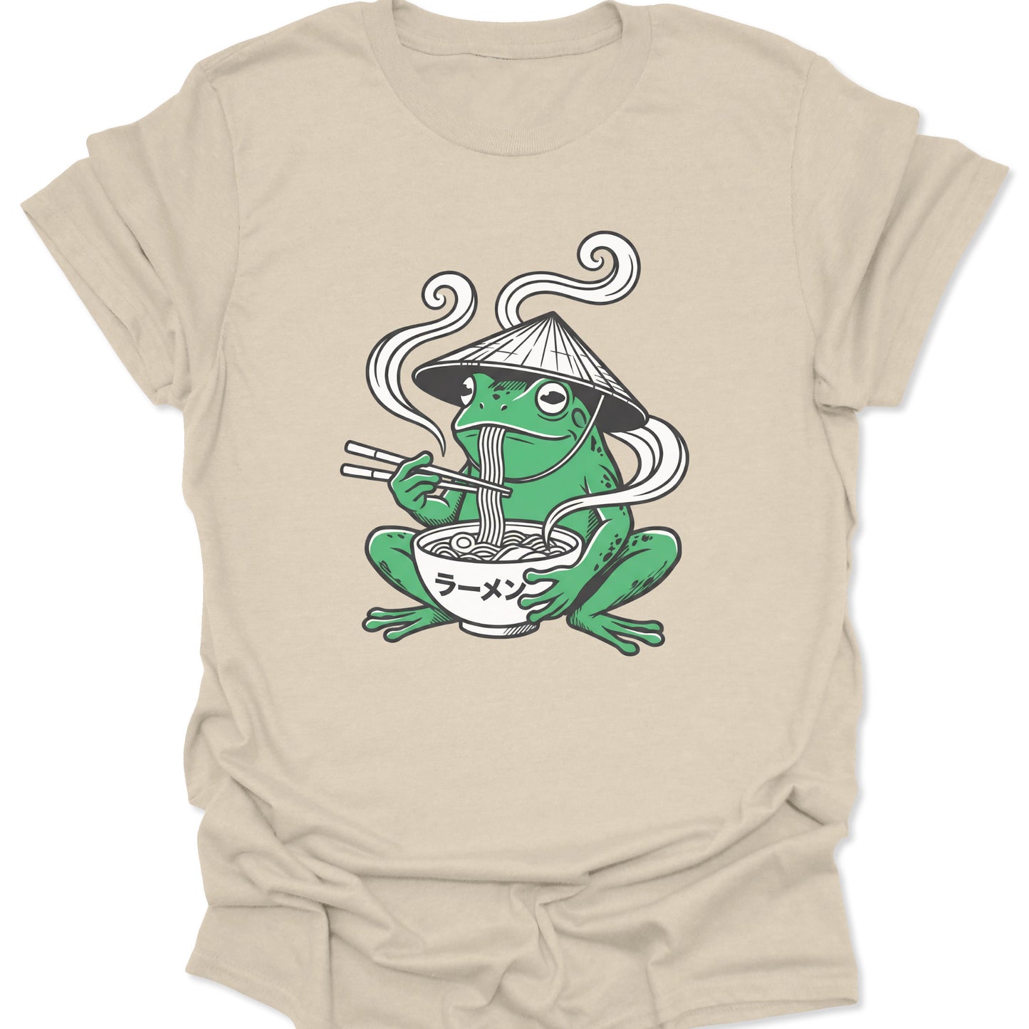 Natural unisex adult t-shirt featuring an aesthetic cottagecore frog in a conical hat enjoying a bowl of steaming ramen.