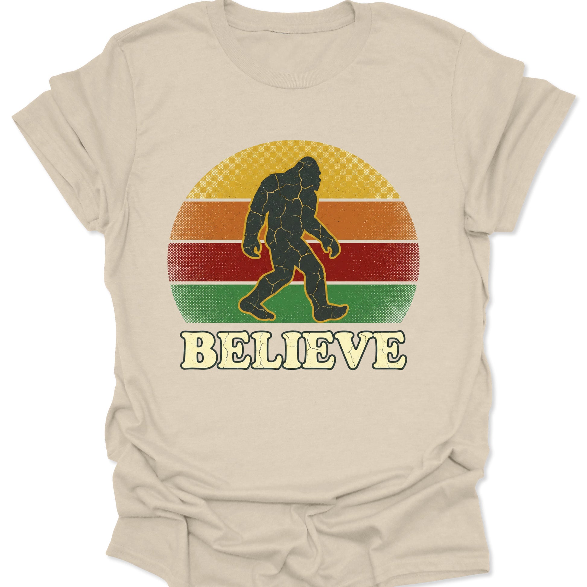 Natural unisex adult t-shirt showing a cracked-texture Bigfoot icon over a 70s aesthetic multi-colored sun.