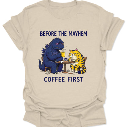 Natural unisex adult t-shirt with vintage style illustration of a giant monster and cat needing caffeine first.