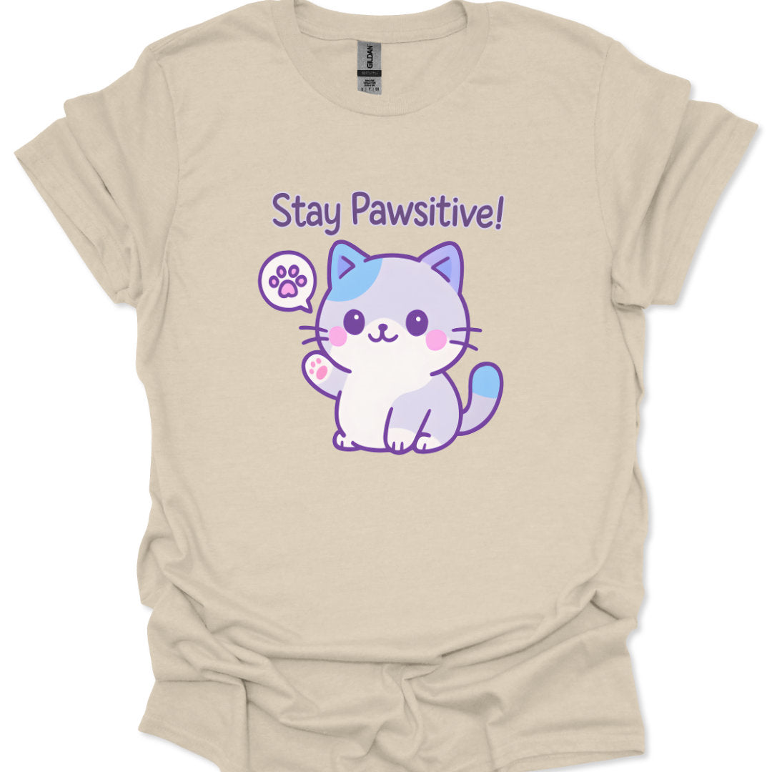 Beige t-shirt with a cartoon cat and 'Stay Pawsitive!' text on a white background