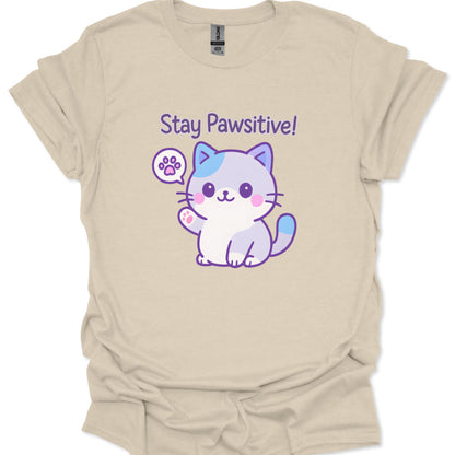 Beige t-shirt with a cartoon cat and 'Stay Pawsitive!' text on a white background