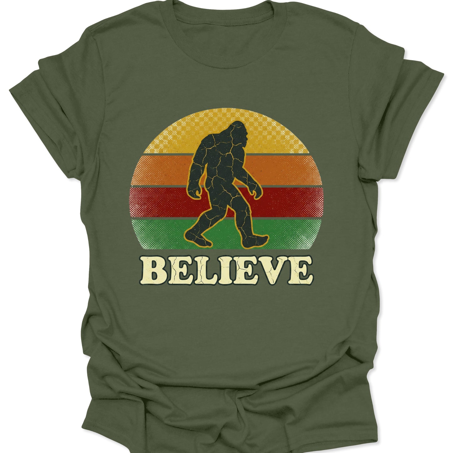 Military green unisex adult t-shirt featuring a retro cryptid hunter design with Bigfoot and bold Believe text.