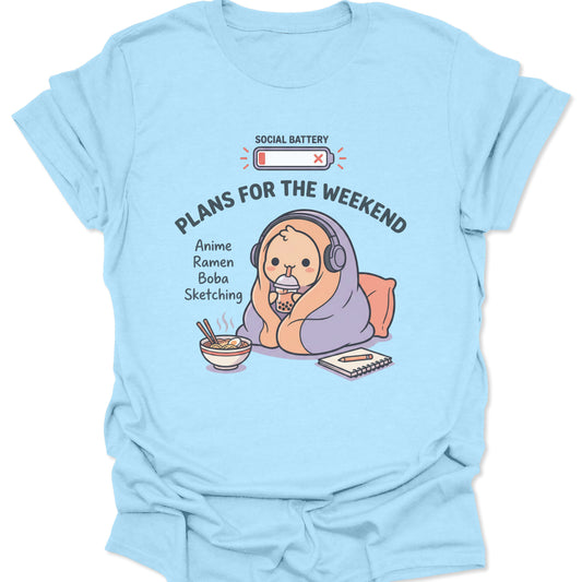 Light blue unisex adult t-shirt with a pastel kawaii character wrapped in a blanket enjoying a quiet weekend at home.