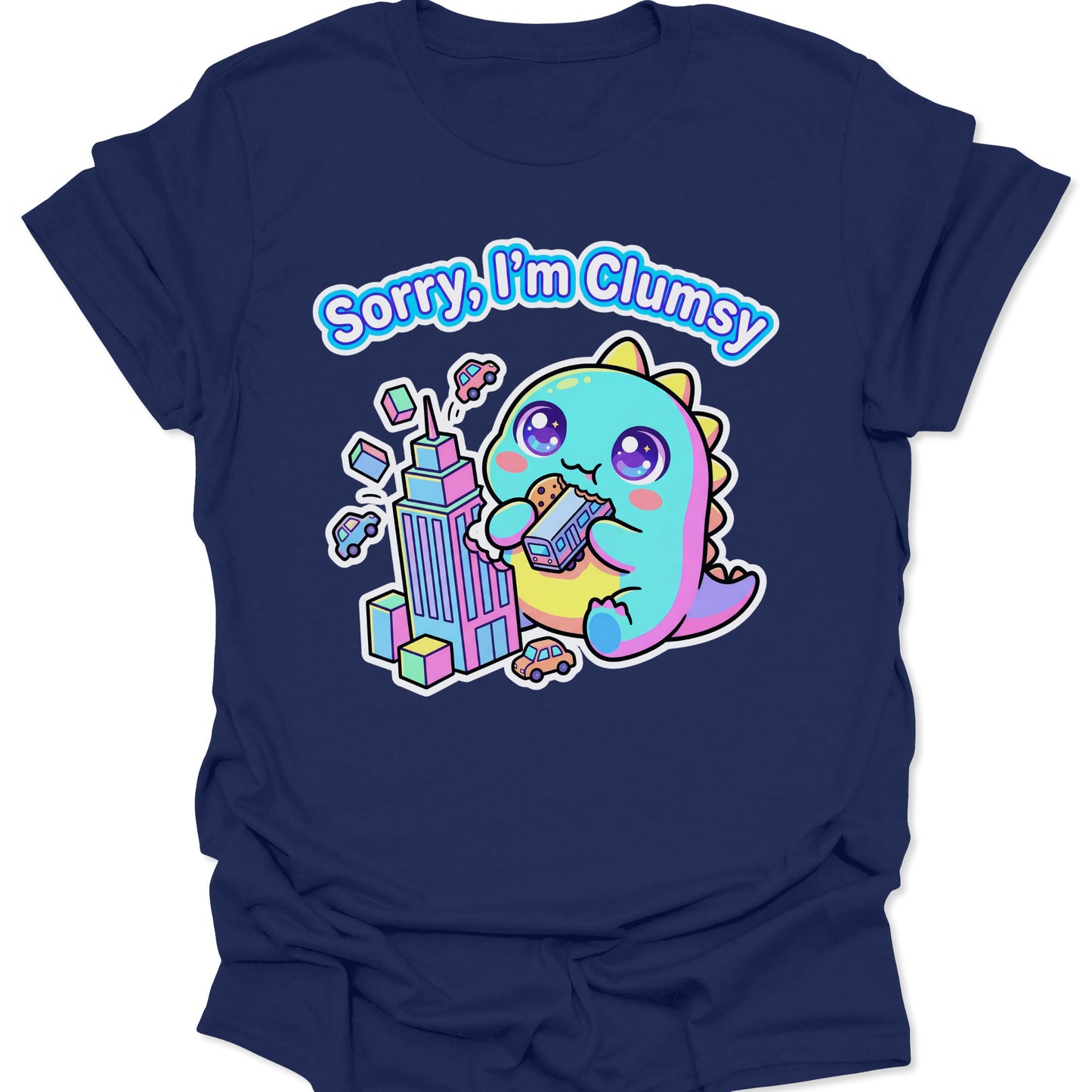 Navy unisex adult t-shirt featuring a pastel chibi kaiju eating a bus with "Sorry, I'm Clumsy" text in bubbly letters.