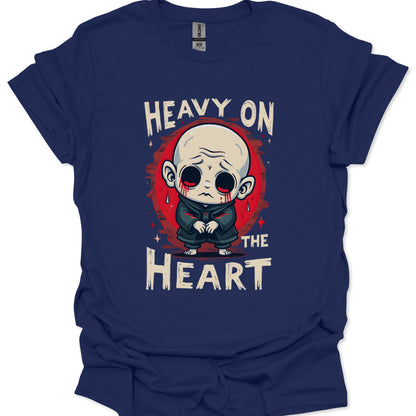 Navy blue t-shirt with a graphic design of a character and text 'Heavy on the Heart' on a white background.