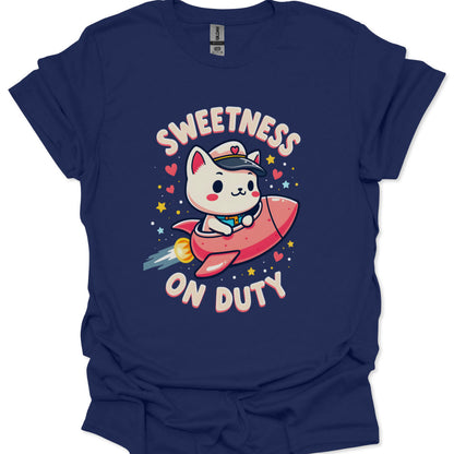 Navy blue t-shirt with a cartoon cat on a rocket and 'Sweetness on Duty' text.
